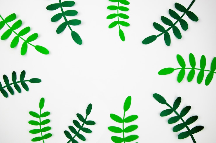 Photo gratuit feuilles tropicales en papier coupé style cadre vert