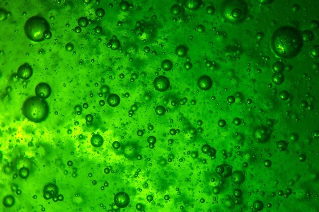 Fond de beaucoup de bulles d'air dans un liquide vert