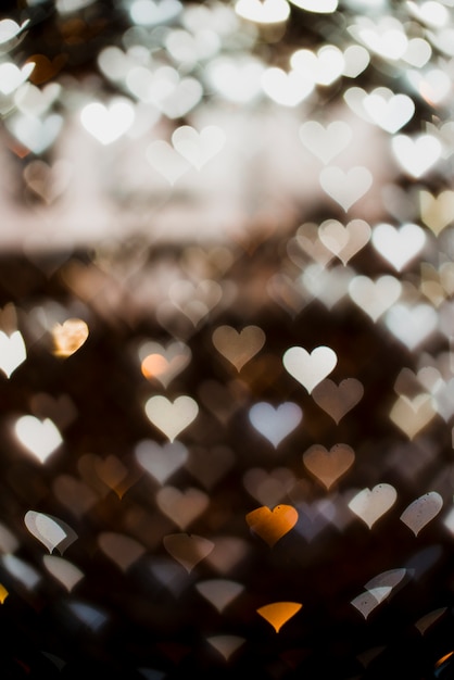 Photo gratuite fond de lumières en forme de coeur blanc