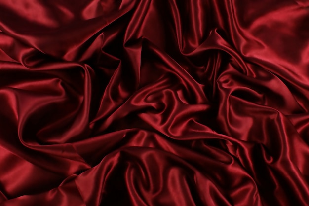 fond de luxe de soie rouge plié