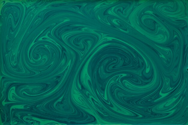 Fond de marbrure texturée de peinture verte et noire liquide