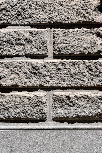 Fond de mur de brique de ciment gris à l'extérieur