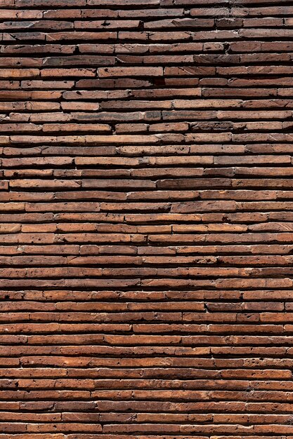 Fond de mur de brique marron vertical