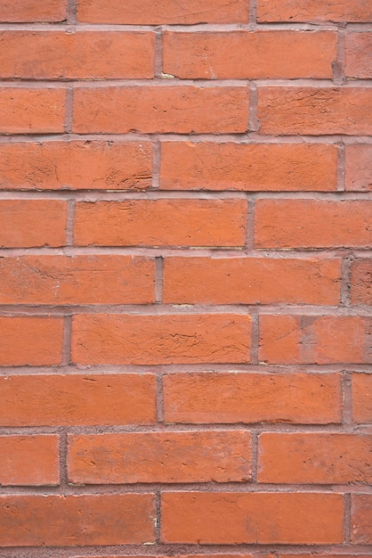 Photo gratuite fond de mur de brique orange