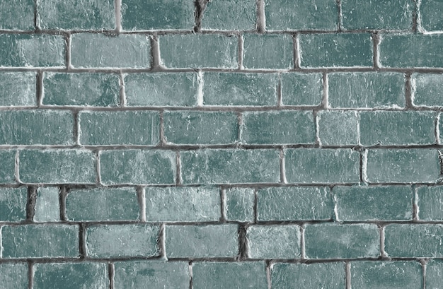 Fond de mur de brique texturé vert
