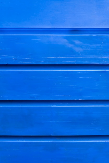 Fond de mur de planches de bois bleu