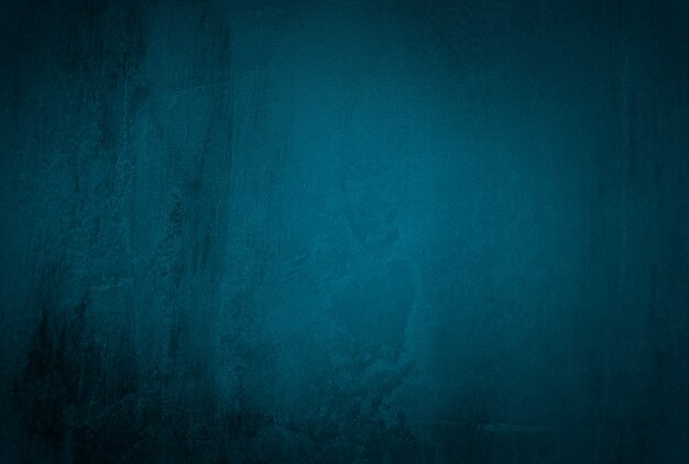 Fond de mur de studio de texture béton bleu grunge vintage avec vignette.