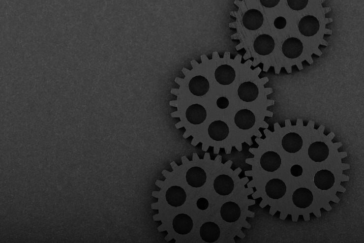 Photo gratuit fond noir avec des engrenages