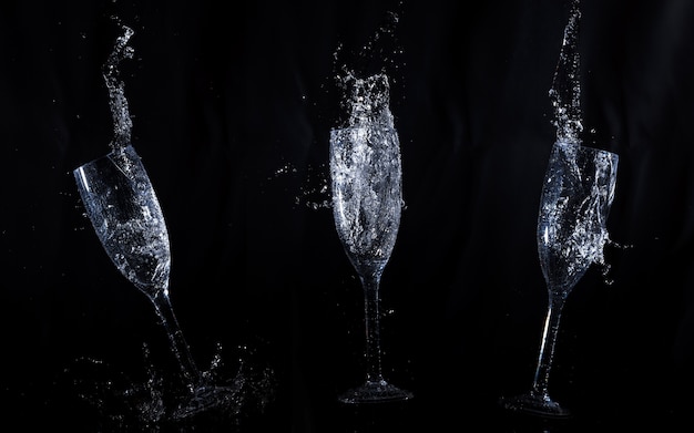 Fond noir avec des lunettes en cristal en mouvement