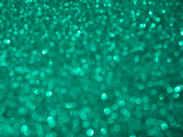 Fond de paillettes turquoise flou