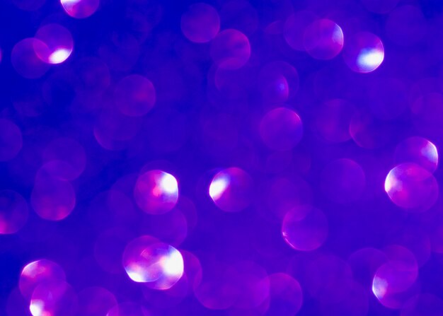 Fond de paillettes violettes floues