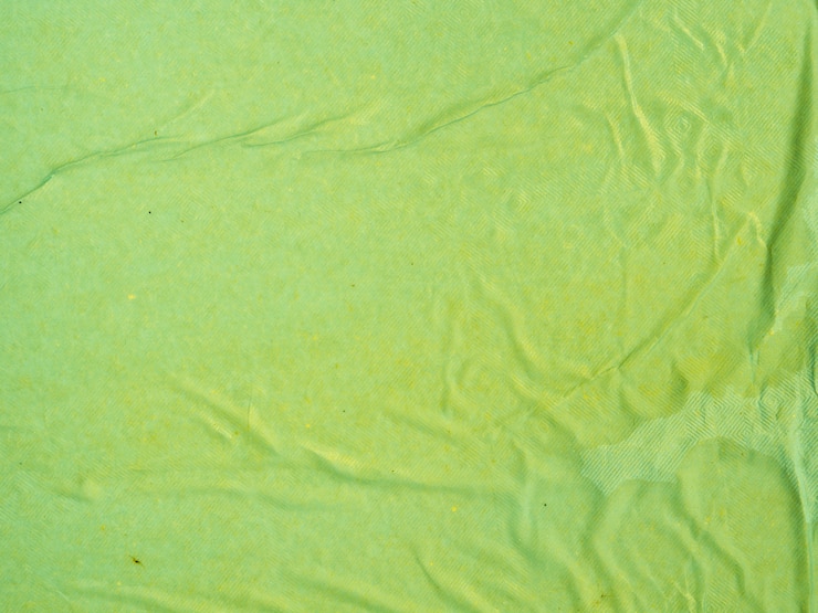 Photo gratuit fond de papier froissé vert