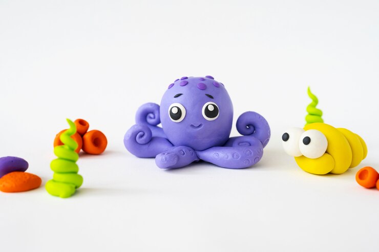 Photo gratuit fond de pâte à modeler avec poulpe