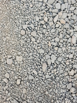 Fond de pierre. cailloux de gravier texture transparente en pierre, marbre. fond sombre de gravier de granit concassé, gros plan.