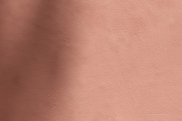 Photo gratuite fond rose ombre avec texture ciment