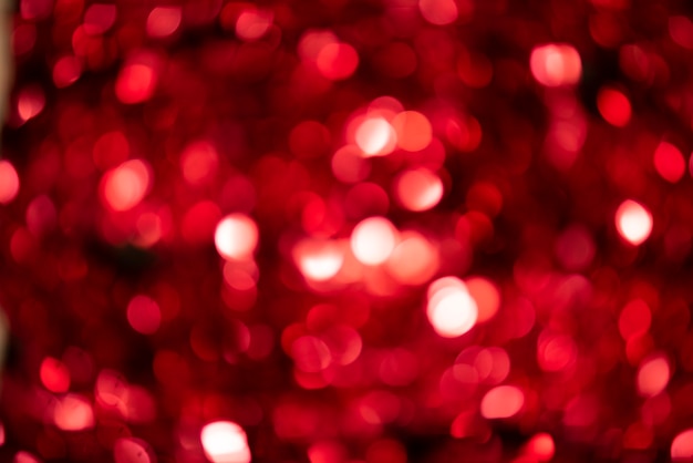 Fond rouge de la lumière de Noël