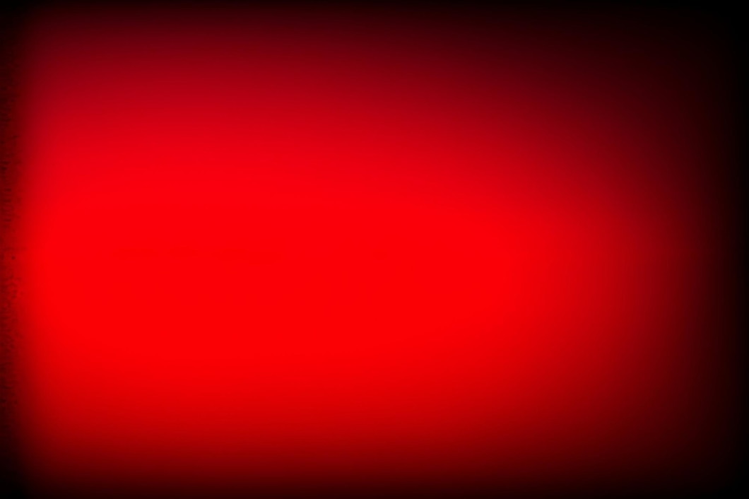 Fond Rouge Avec Une Lumière Rouge Au Milieu Photo Gratuite