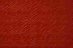 Photo gratuite un fond rouge avec des vagues et un motif de vagues.