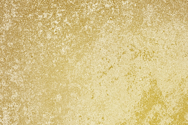 Fond de surface de mur en béton peint à peu près or