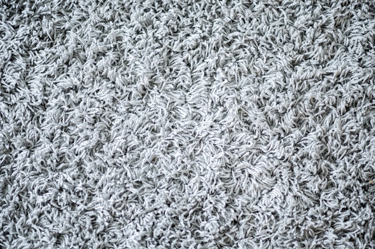 Photo gratuit fond de tapis blanc doux à l'intérieur
