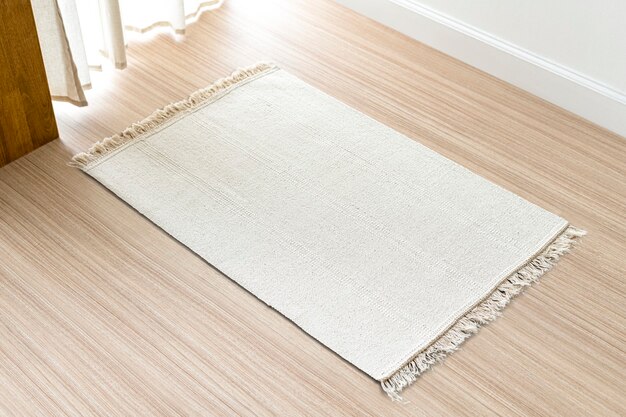 Fond de tapis tissé blanc sur le sol