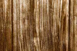 Photo gratuite fond texturé en bois peint en or rustique