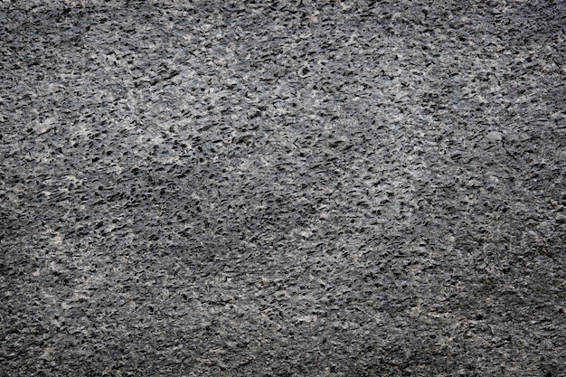 Fond texturé ciment grossièrement gris