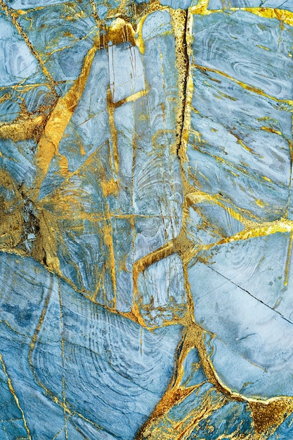Fond texturé en marbre bleu et or