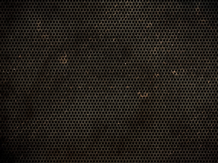 Photo gratuit fond de texture métallique perforé grunge