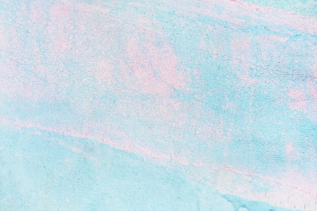 Fond texturé de peinture bleu et rose
