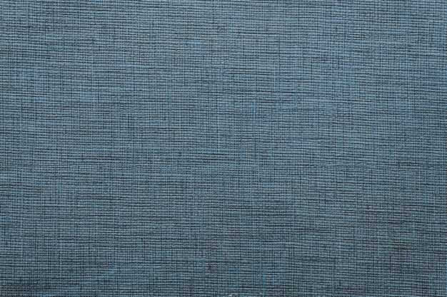 Fond texturé de tapis en tissu bleu