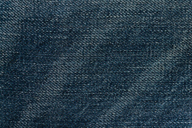 Fond texturé de tapis en tissu bleu