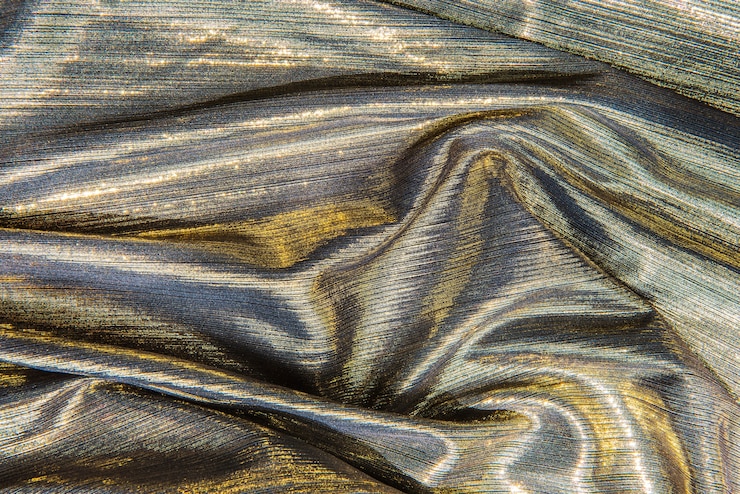 Photo gratuit fond texturé en tissu argent brillant
