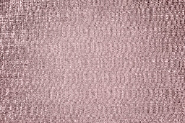 Fond texturé de tissu de coton d'or rose