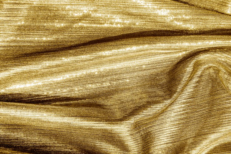 Photo gratuit fond texturé en tissu doré soyeux