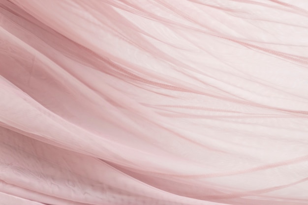 Fond de texture de tissu mousseline rose