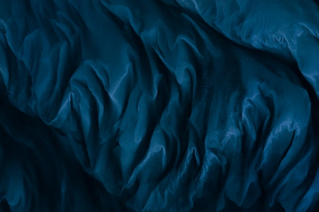 Fond texturé en tissu de soie bleu marine