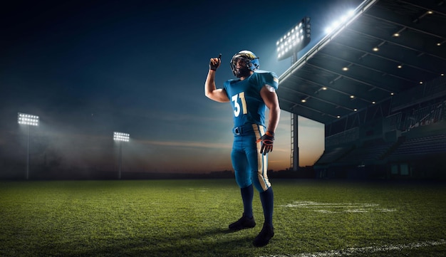 Photo gratuite football américain joueur de football américain dans un stade de sport professionnel