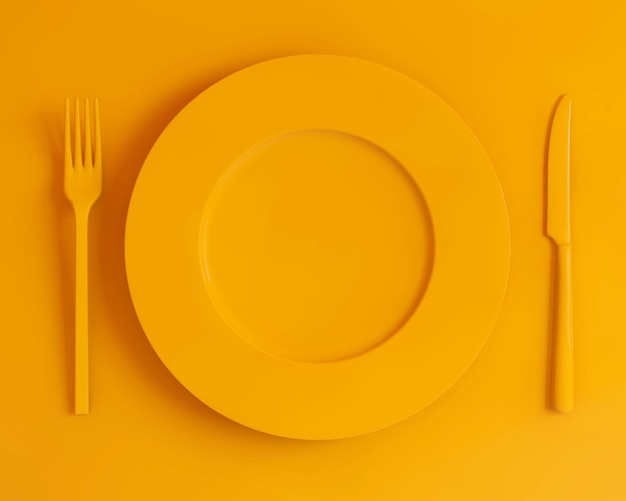 Photo gratuite fourchette et couteau à assiette jaune vue de dessus sur fond jaune