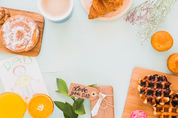 Frontière de la pâtisserie et des cadeaux pour le père