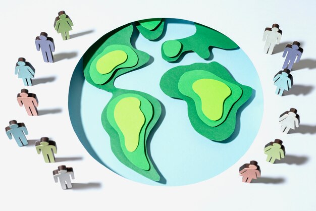 Globe terrestre de style papier avec des silhouettes