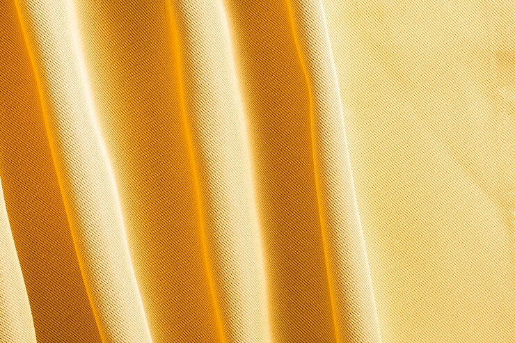 Photo gratuit gros plan élégant fond de tissu doré