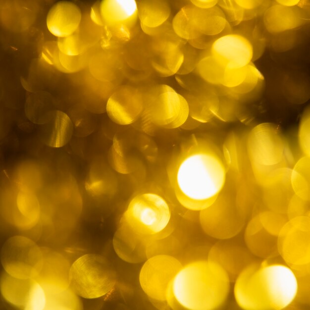 Gros plan des lumières scintillantes d'or