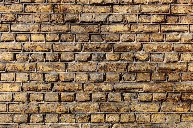 Gros plan d'un mur fait de pierres rectangulaires texture background