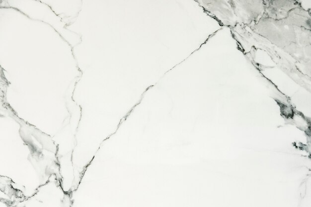 Gros plan d'un mur texturé en marbre blanc