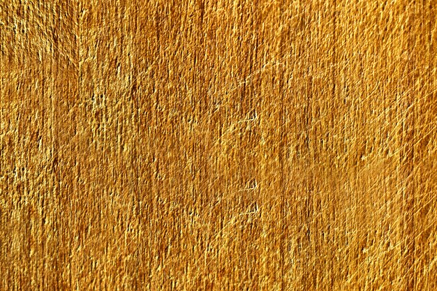 Gros plan d&#39;une texture de mur en béton rayé jaune