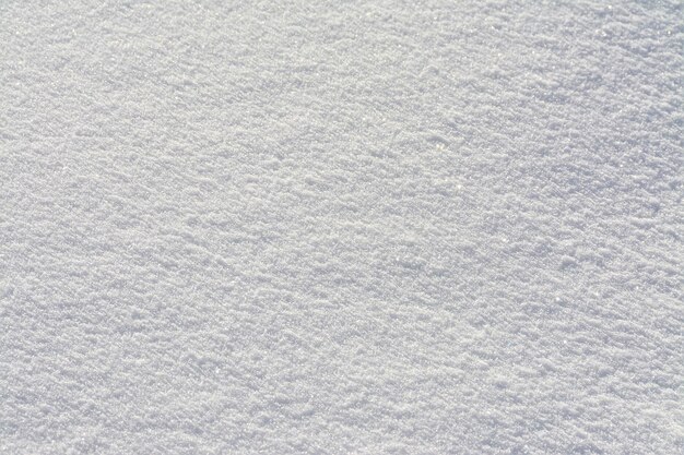 Gros plan de la texture de la surface de la neige blanche fraîche