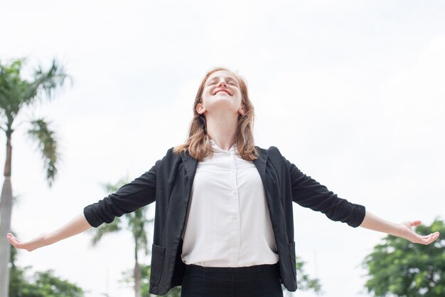 Happy Business Lady Spreading Hands Outdoors