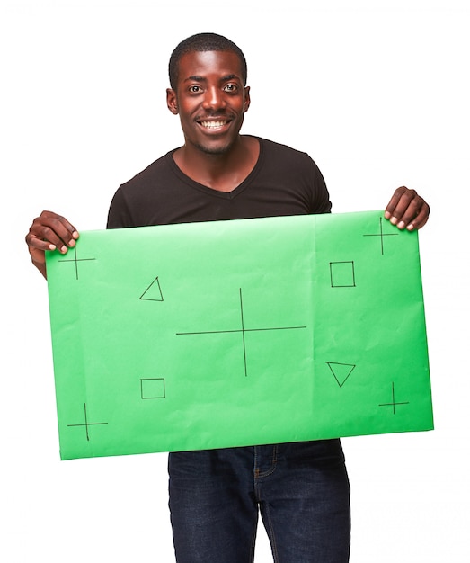 homme africain souriant comme homme d & # 39; affaires noir avec panneau vert