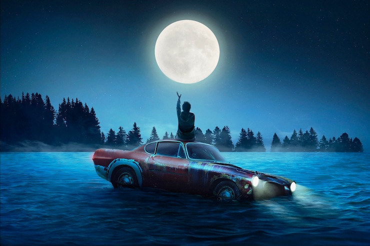 Photo gratuit homme assis sur la vue arrière de la voiture